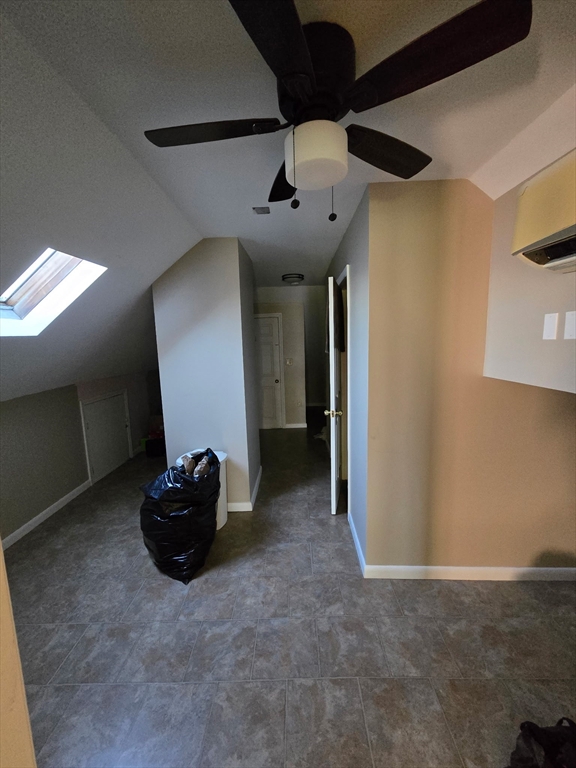 1942 Acushnet Avenue, Unit 2 New Bedford, MA 02745 - Photo 9 of 10 a view of a livingroom with a ceiling fan and window