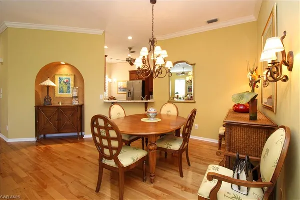 a dining room with furniture and window