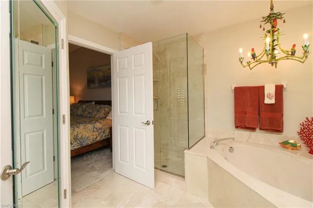 a bathroom with a tub sink and mirror