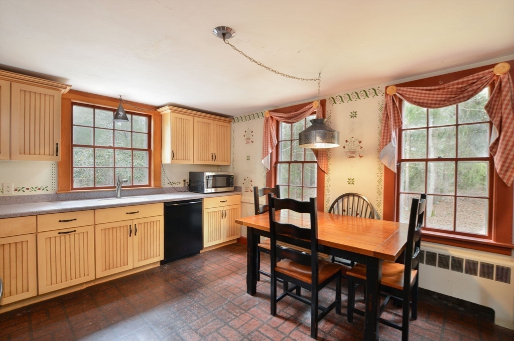 158 Great Neck Road Wareham, MA 02571 - Photo 20 of 42 a kitchen with stainless steel appliances granite countertop a stove a sink and a refrigerator