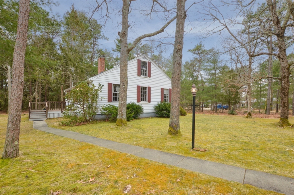158 Great Neck Road Wareham, MA 02571 - Photo 7 of 42 a front view of a house with a yard and tree s