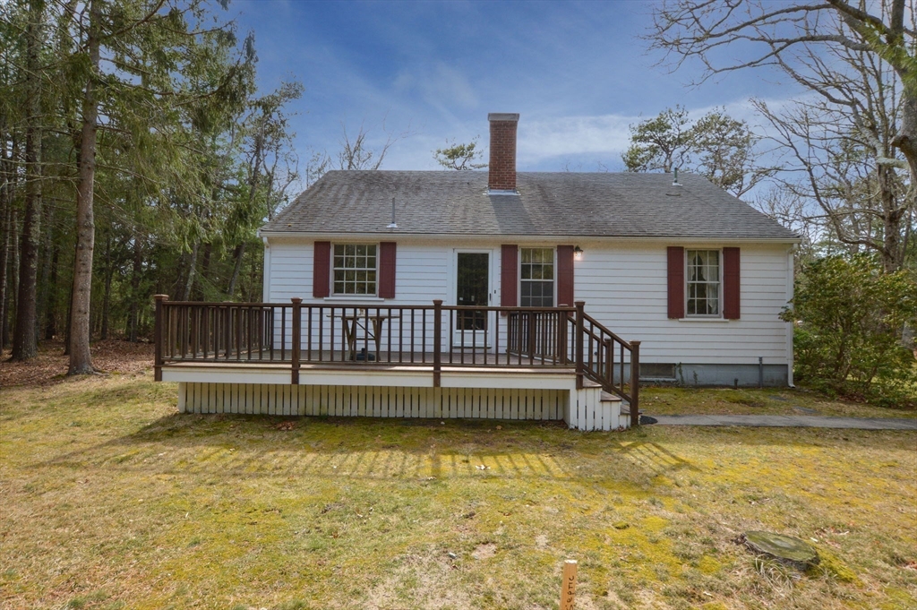 158 Great Neck Road Wareham, MA 02571 - Photo 8 of 42 a view of a house with a wooden deck and a swimming pool
