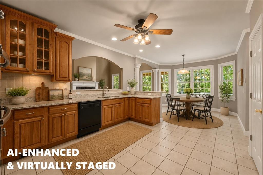 1040 Auburn Road Dacula, GA 30019 - Photo 13 of 42 a kitchen with a sink dining table and chairs