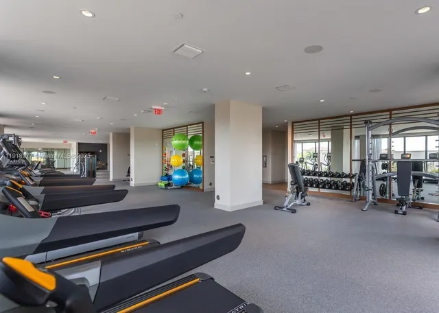 a swimming pool with outdoor seating and yard