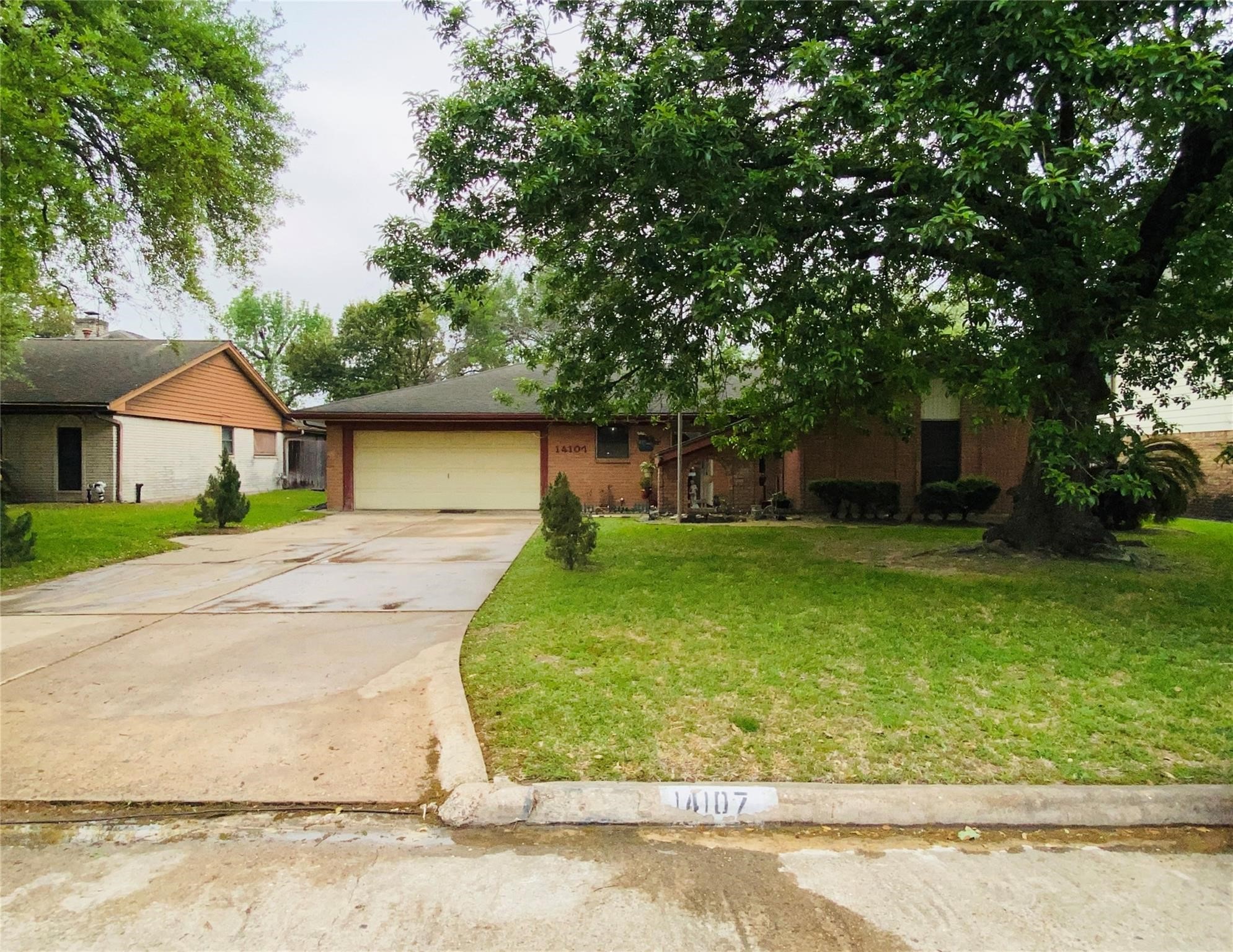 14107 Waterville Way Houston, TX 77015 - Photo 1 of 12 front view of a house with a yard
