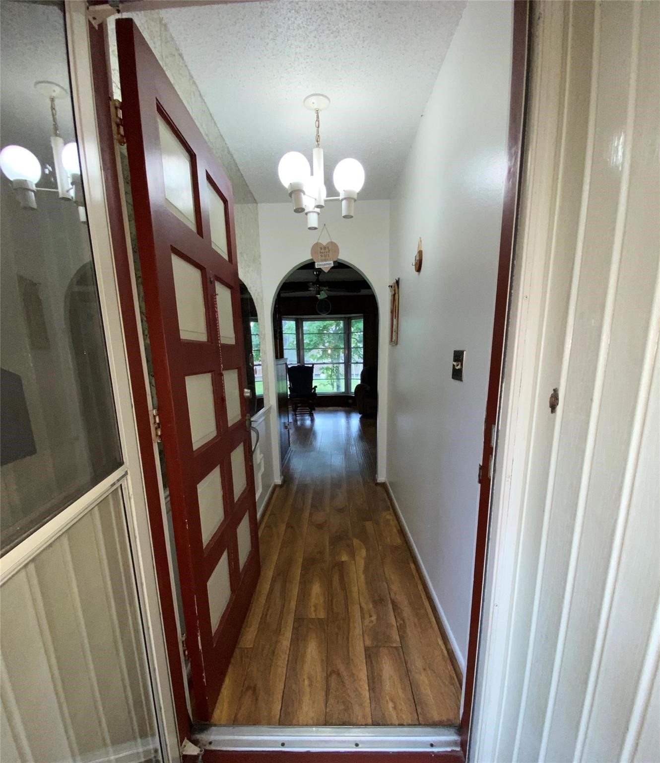 14107 Waterville Way Houston, TX 77015 - Photo 2 of 12 a view of a hallway with wooden floor and staircase