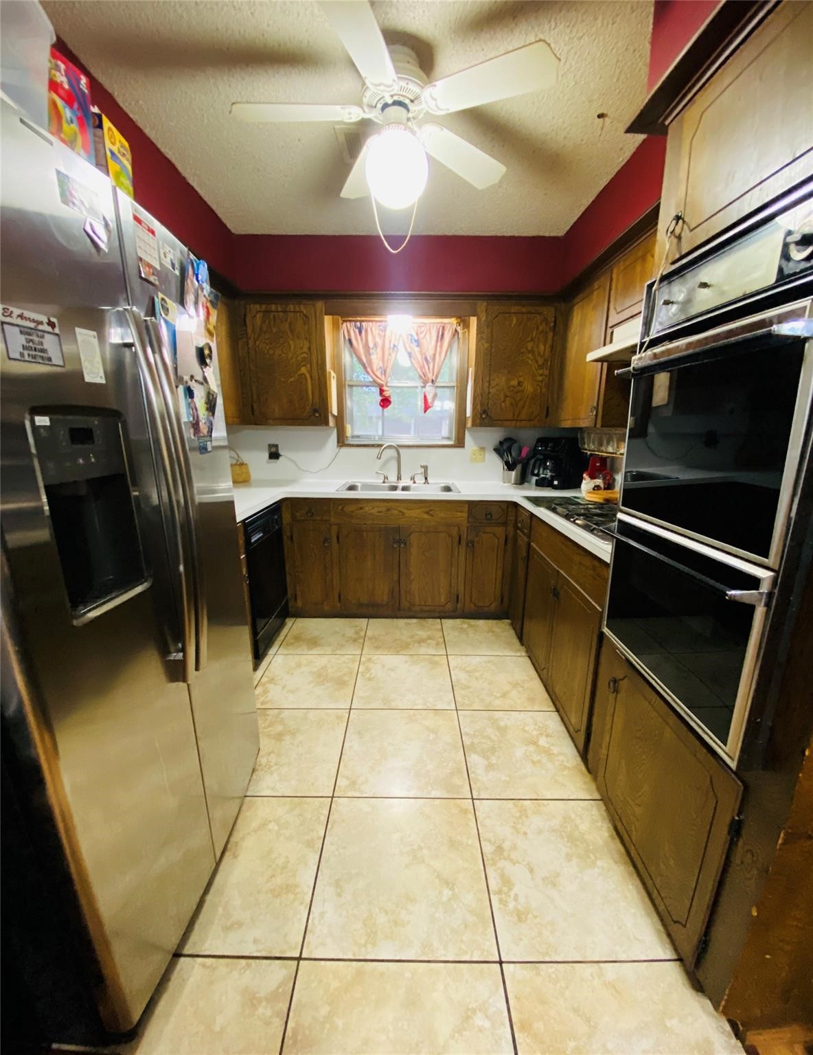 14107 Waterville Way Houston, TX 77015 - Photo 7 of 12 a kitchen with stainless steel appliances granite countertop a refrigerator and a sink
