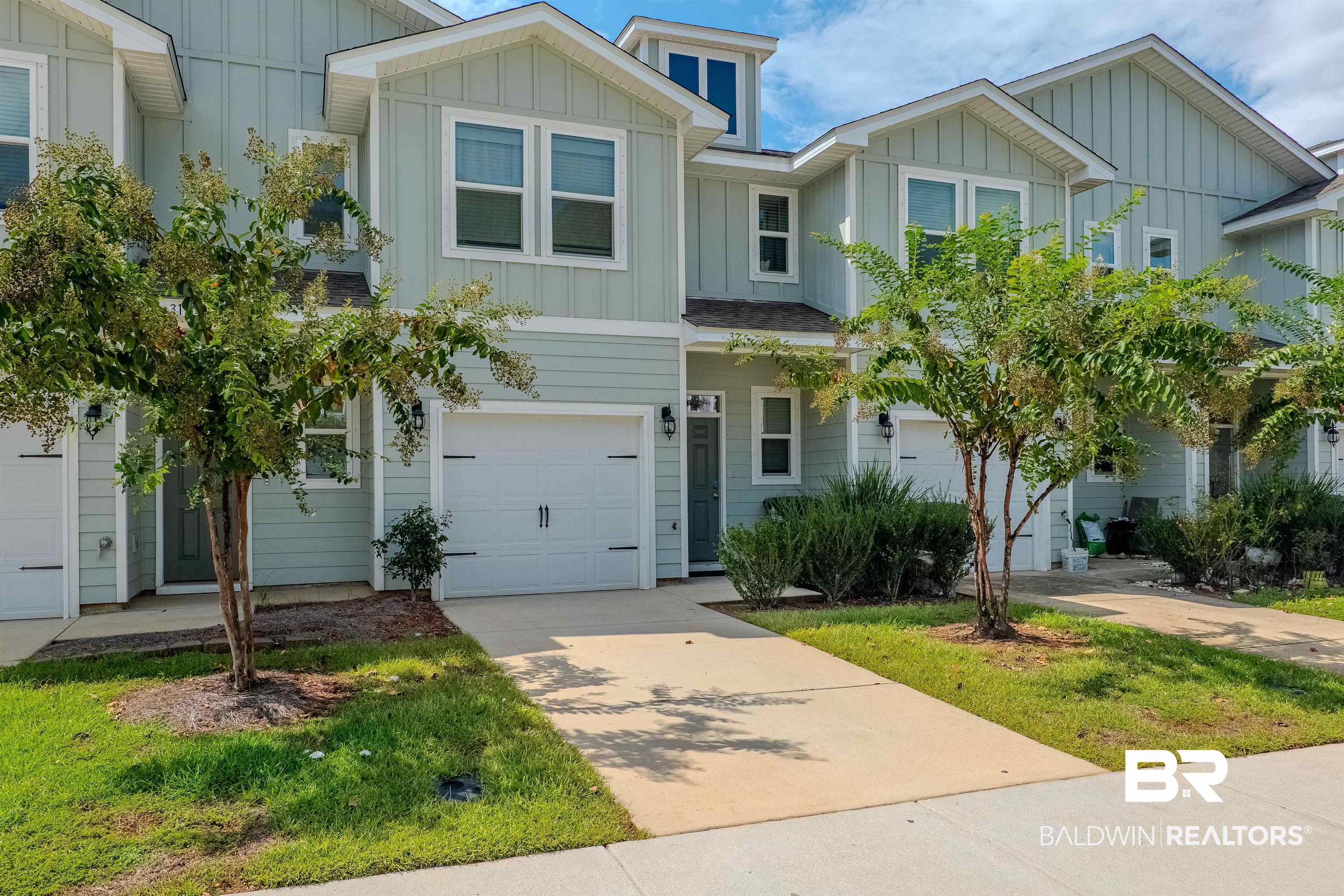 25806 Pollard Road, Unit 32 Daphne, AL 36526 - Photo 1 of 23 Townhome / multi-family property with a garage