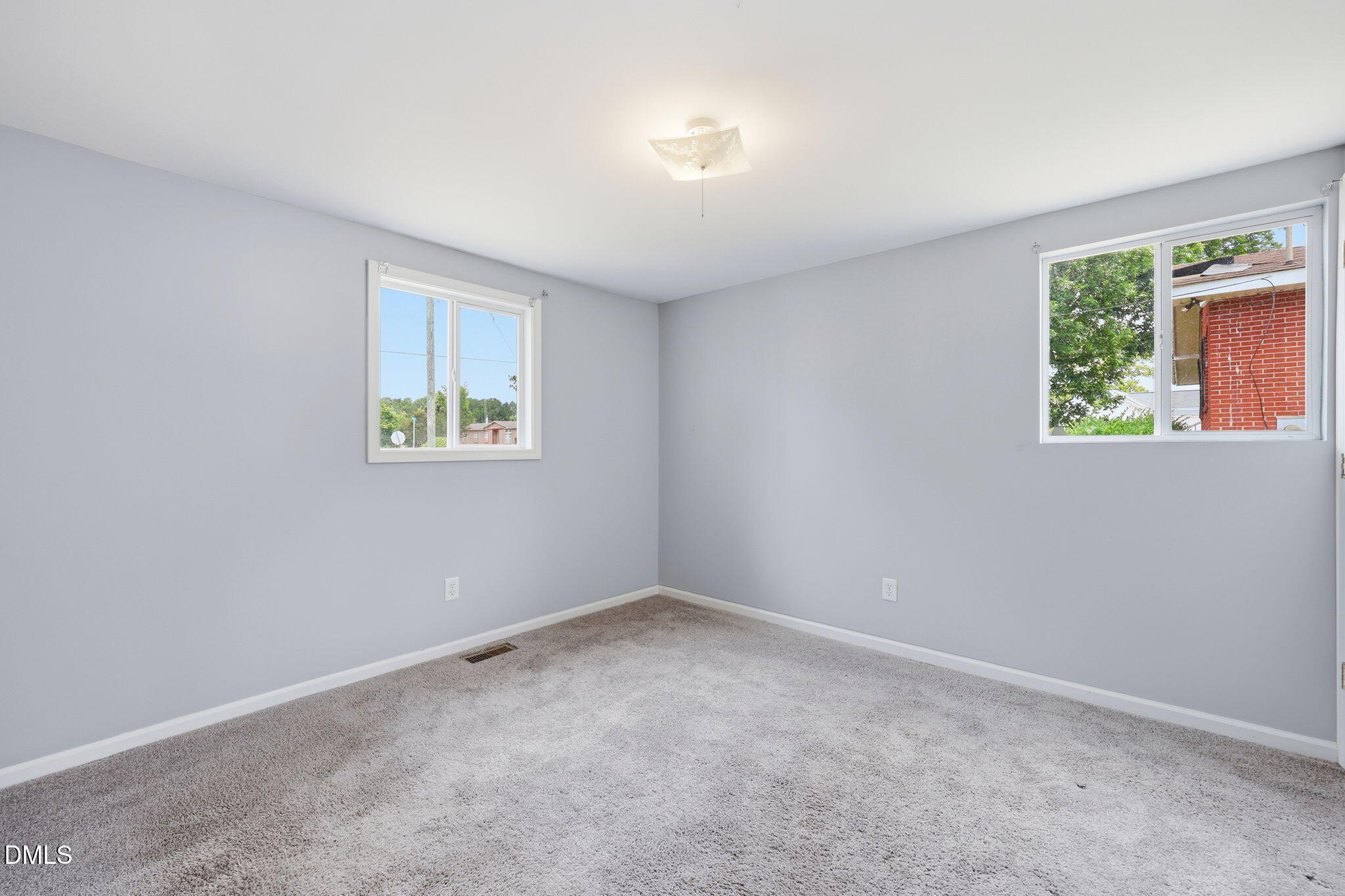 1758 Barber Mill Road Clayton, NC 27520 - Photo 19 of 41 an empty room with windows