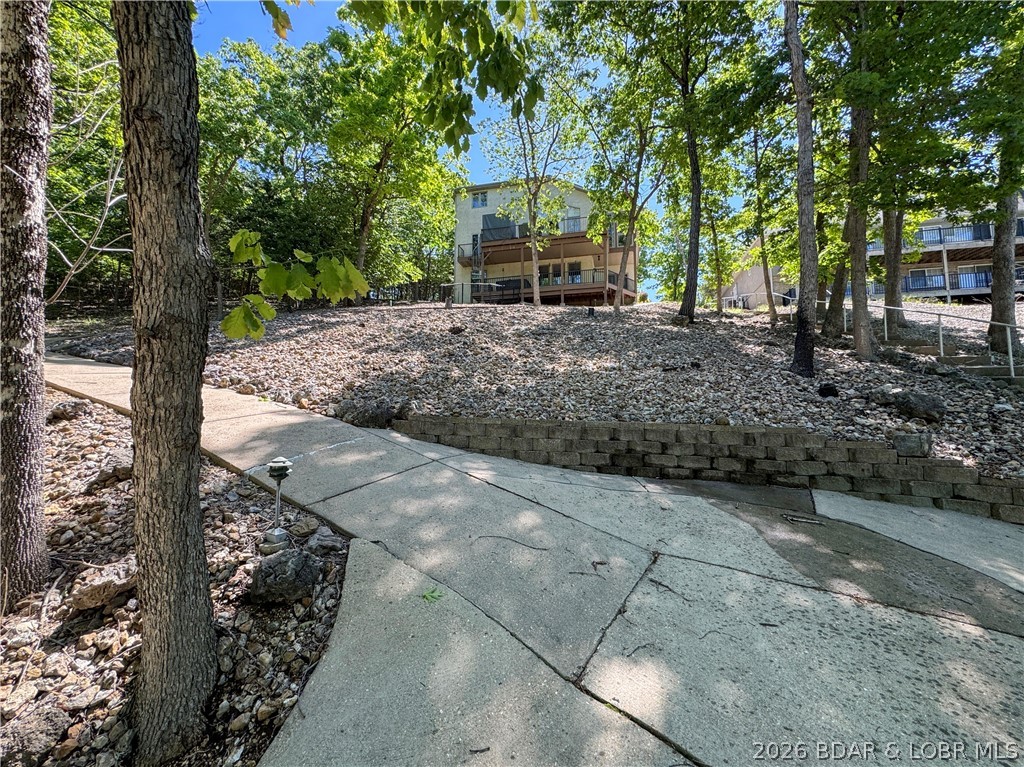 177 Ridgewood Drive Lake Ozark, MO 65049 - Photo 32 of 40 Golf Cart Path to Parking Area