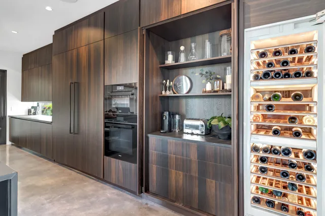 a bedroom with a large bed and a large window