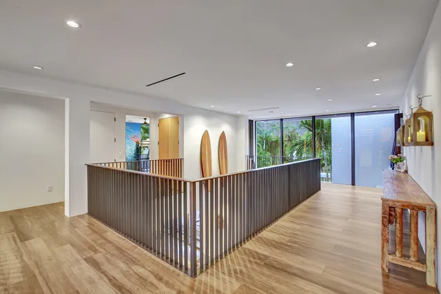 an aerial view of residential houses with outdoor space and street view