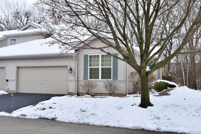 a view of a house covered in snow