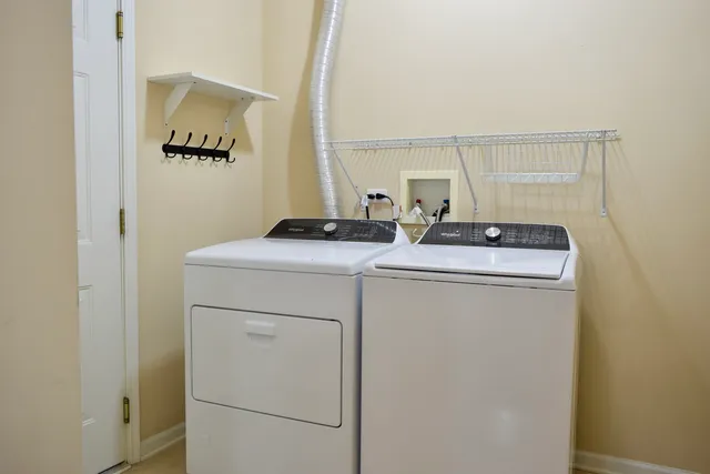 a utility room with dryer and washer