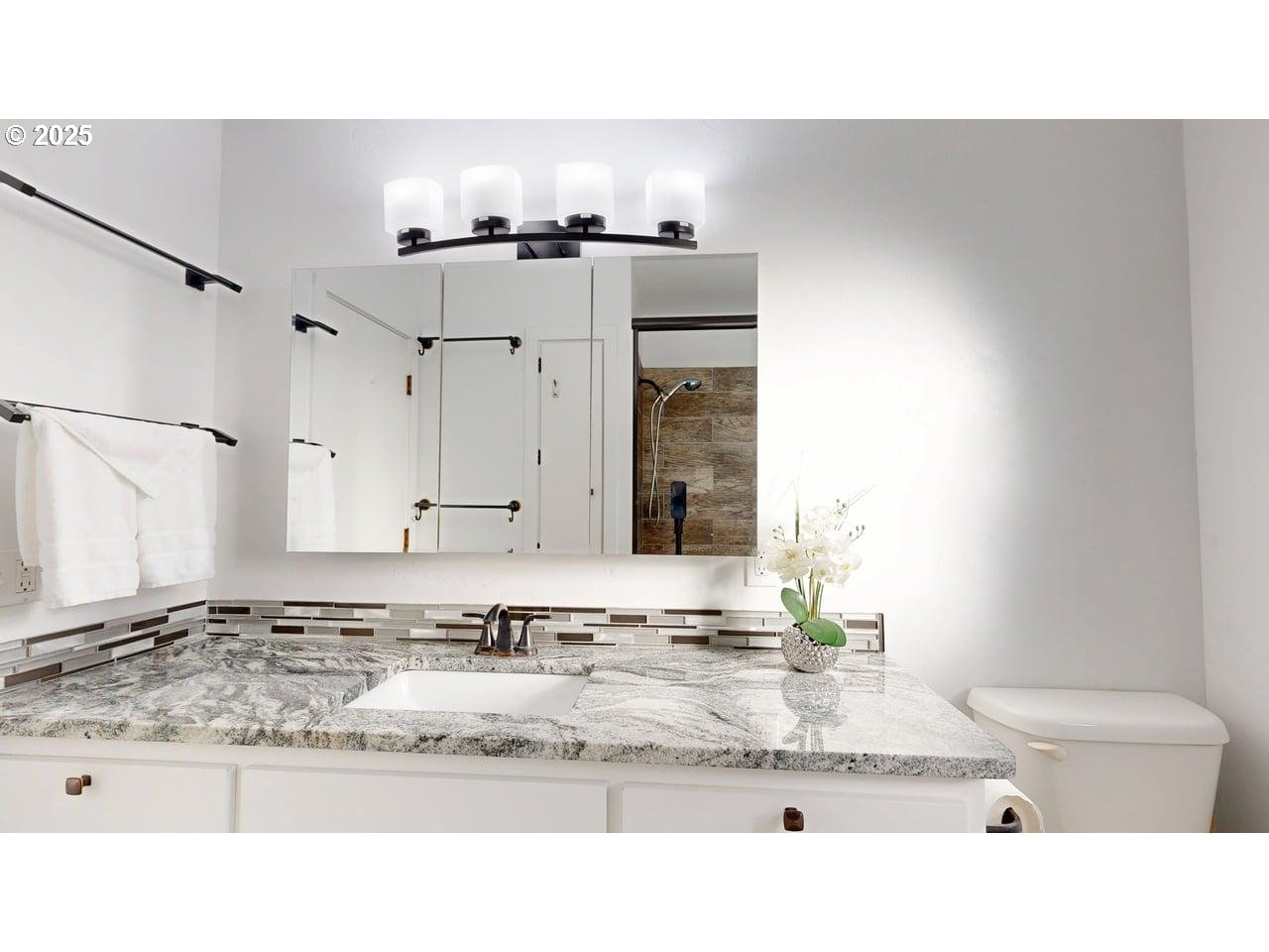 425 Memory Lane Brookings, OR 97415 - Photo 16 of 25 a bathroom with a sink granite and a vanity