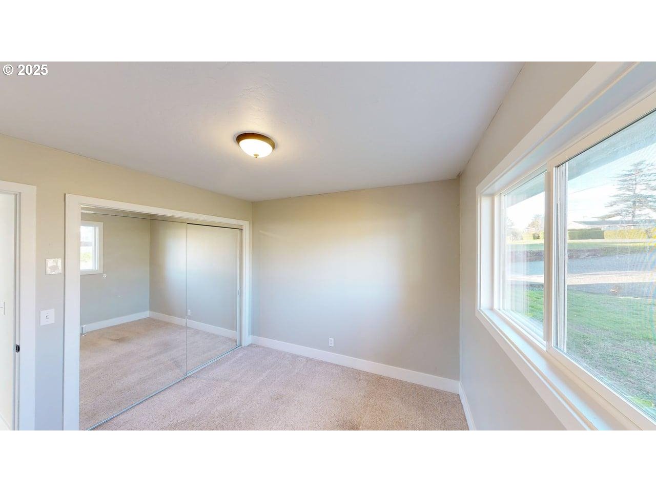 425 Memory Lane Brookings, OR 97415 - Photo 20 of 25 a open hall with a ceiling fan and a window
