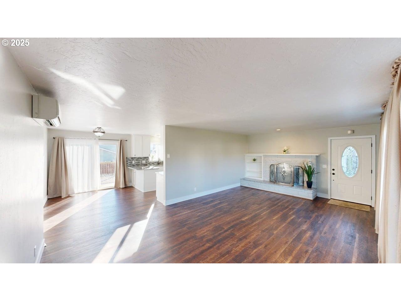 425 Memory Lane Brookings, OR 97415 - Photo 5 of 25 a living room with a couch and a wooden floor