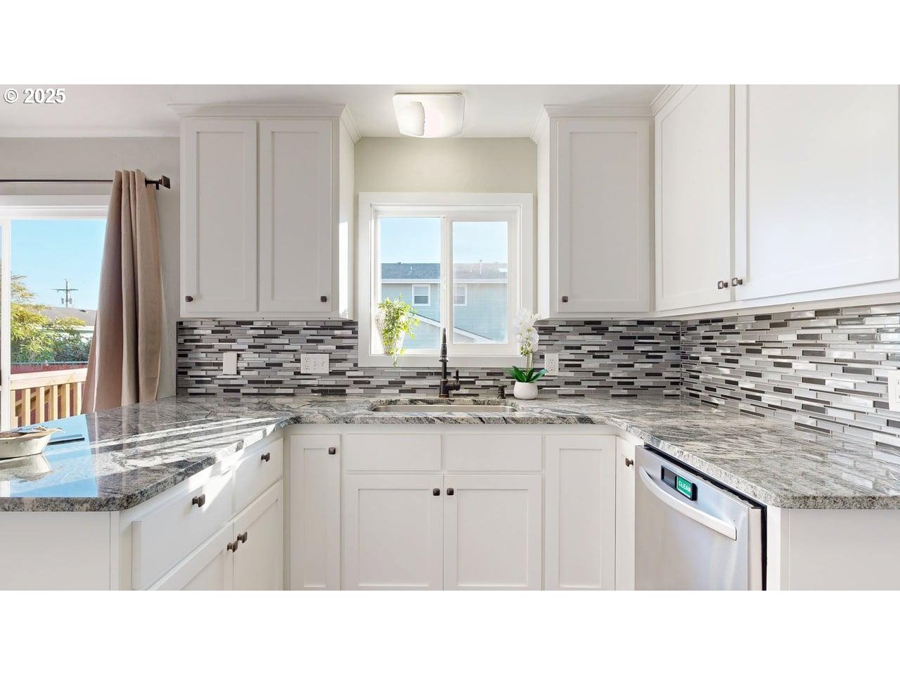 425 Memory Lane Brookings, OR 97415 - Photo 10 of 25 a kitchen with granite countertop a sink stove and cabinets