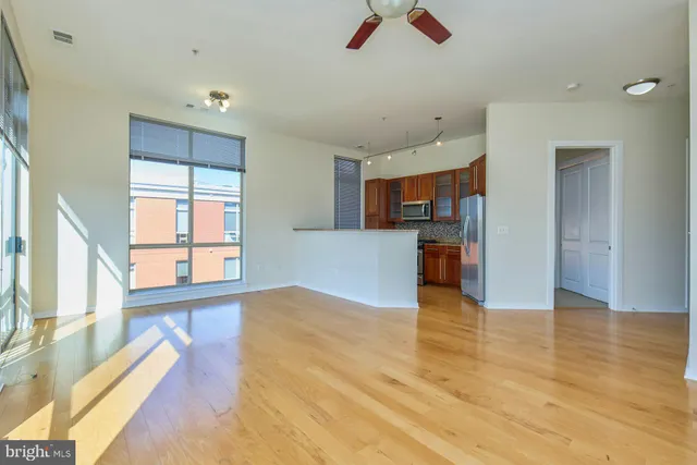 a view of a kitchen with a sink and a window