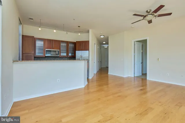 a view of a kitchen with a sink and a cabinet