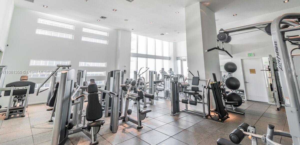 1040 Biscayne Boulevard, Unit 2403 Miami, FL 33132 - Photo 13 of 25 a view of a room with gym equipment