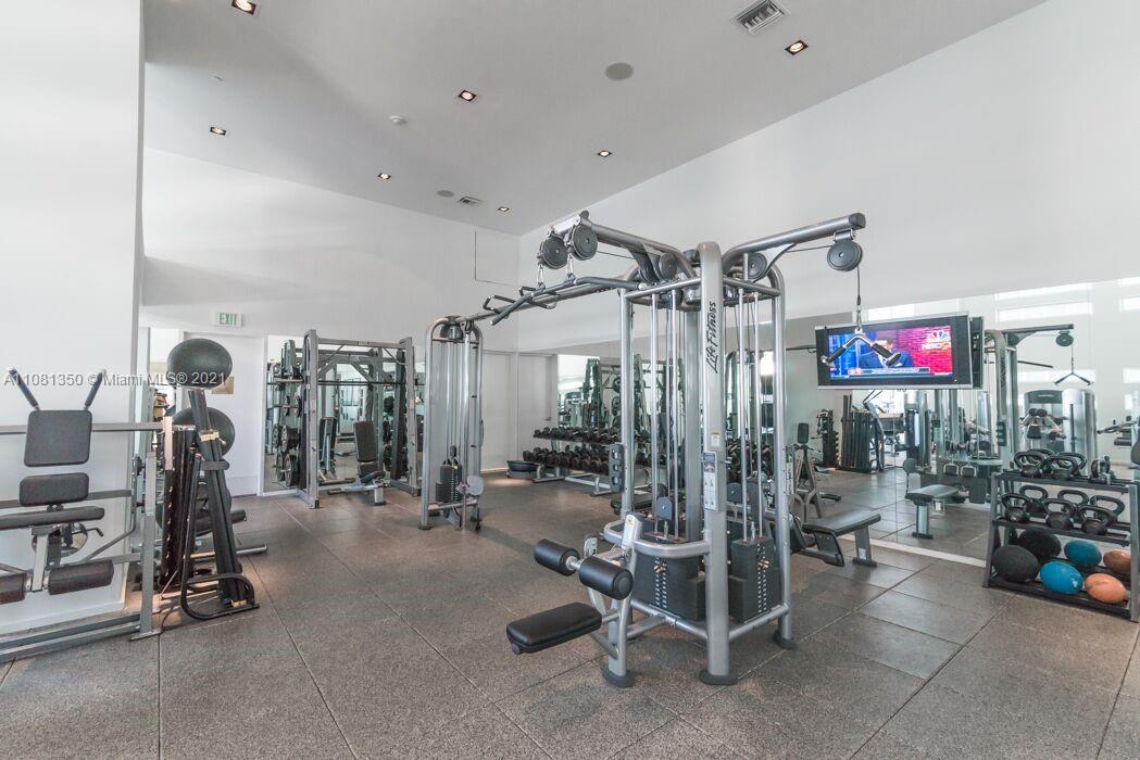 1040 Biscayne Boulevard, Unit 2403 Miami, FL 33132 - Photo 14 of 25 a view of a room with gym equipment