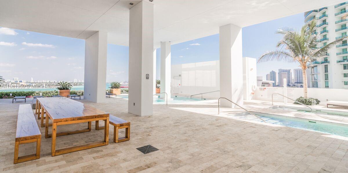 1040 Biscayne Boulevard, Unit 2403 Miami, FL 33132 - Photo 18 of 25 a view of a livingroom with furniture and front door