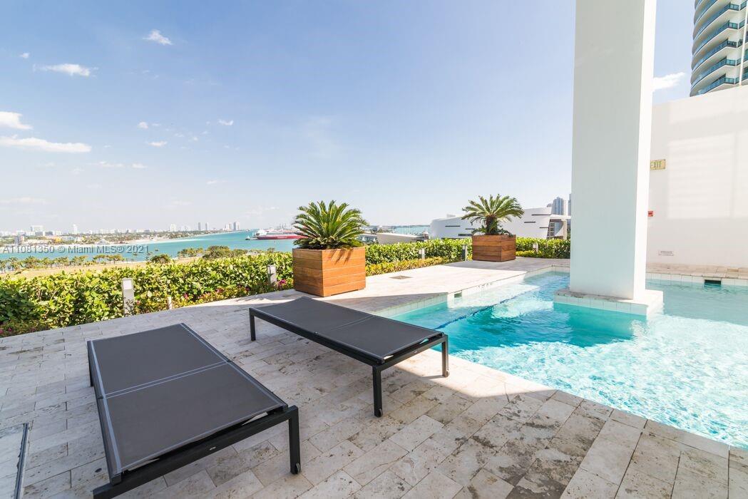 1040 Biscayne Boulevard, Unit 2403 Miami, FL 33132 - Photo 19 of 25 swimming pool view with a seating space
