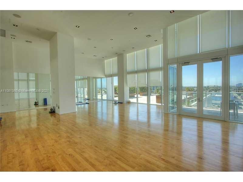 1040 Biscayne Boulevard, Unit 2403 Miami, FL 33132 - Photo 22 of 25 a view of an empty room with glass door