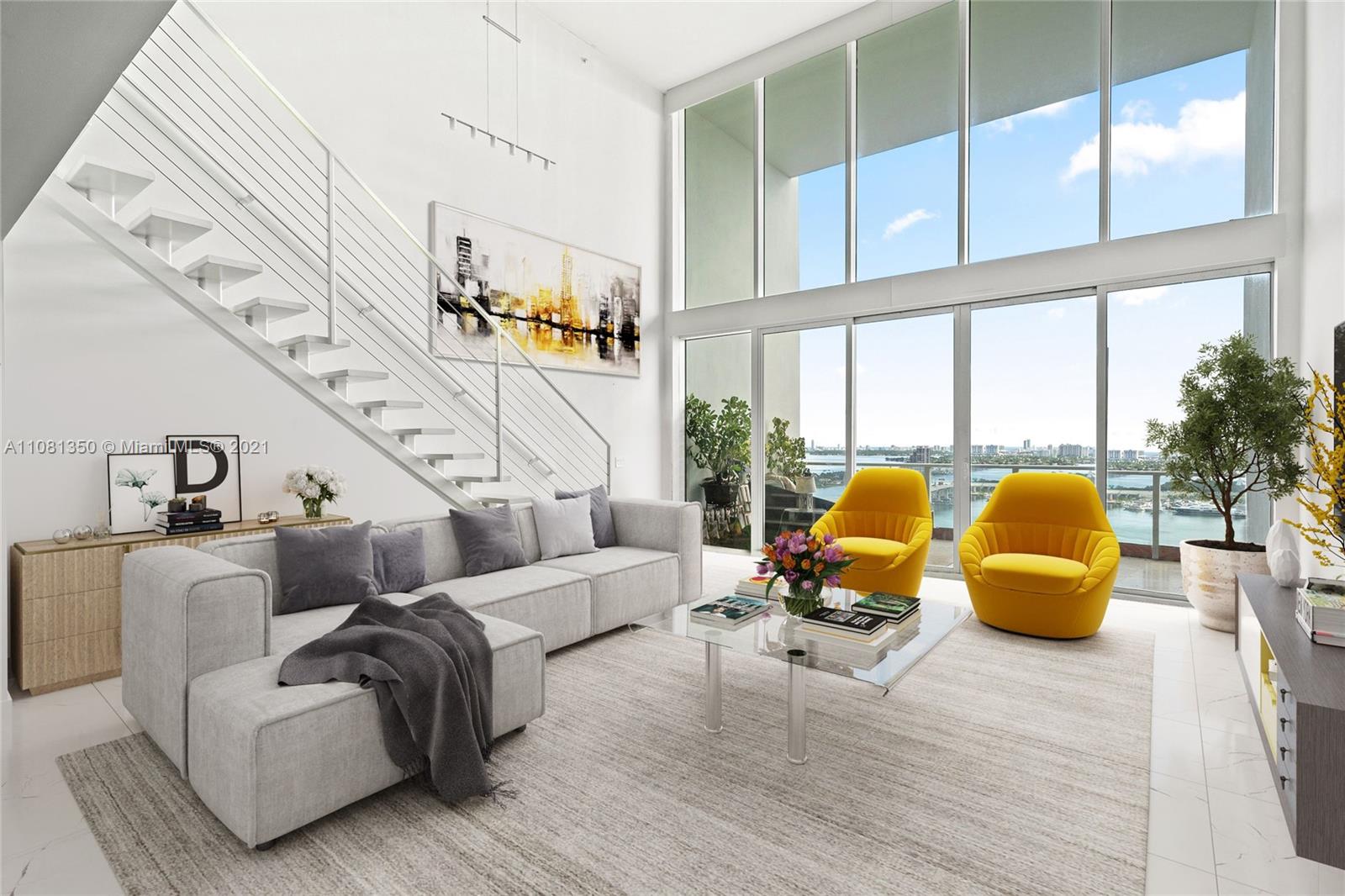 1040 Biscayne Boulevard, Unit 2403 Miami, FL 33132 - Photo 5 of 25 a living room with furniture and large windows