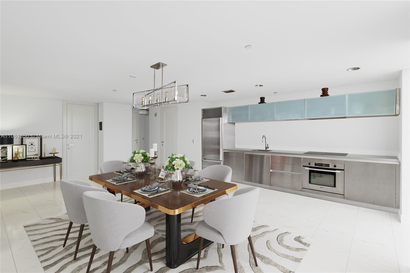 1040 Biscayne Boulevard, Unit 2403 Miami, FL 33132 - Photo 6 of 25 a view of a dining room with furniture