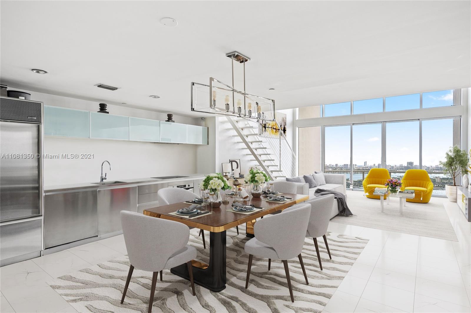 1040 Biscayne Boulevard, Unit 2403 Miami, FL 33132 - Photo 7 of 25 a view of a dining room with furniture window and outside view