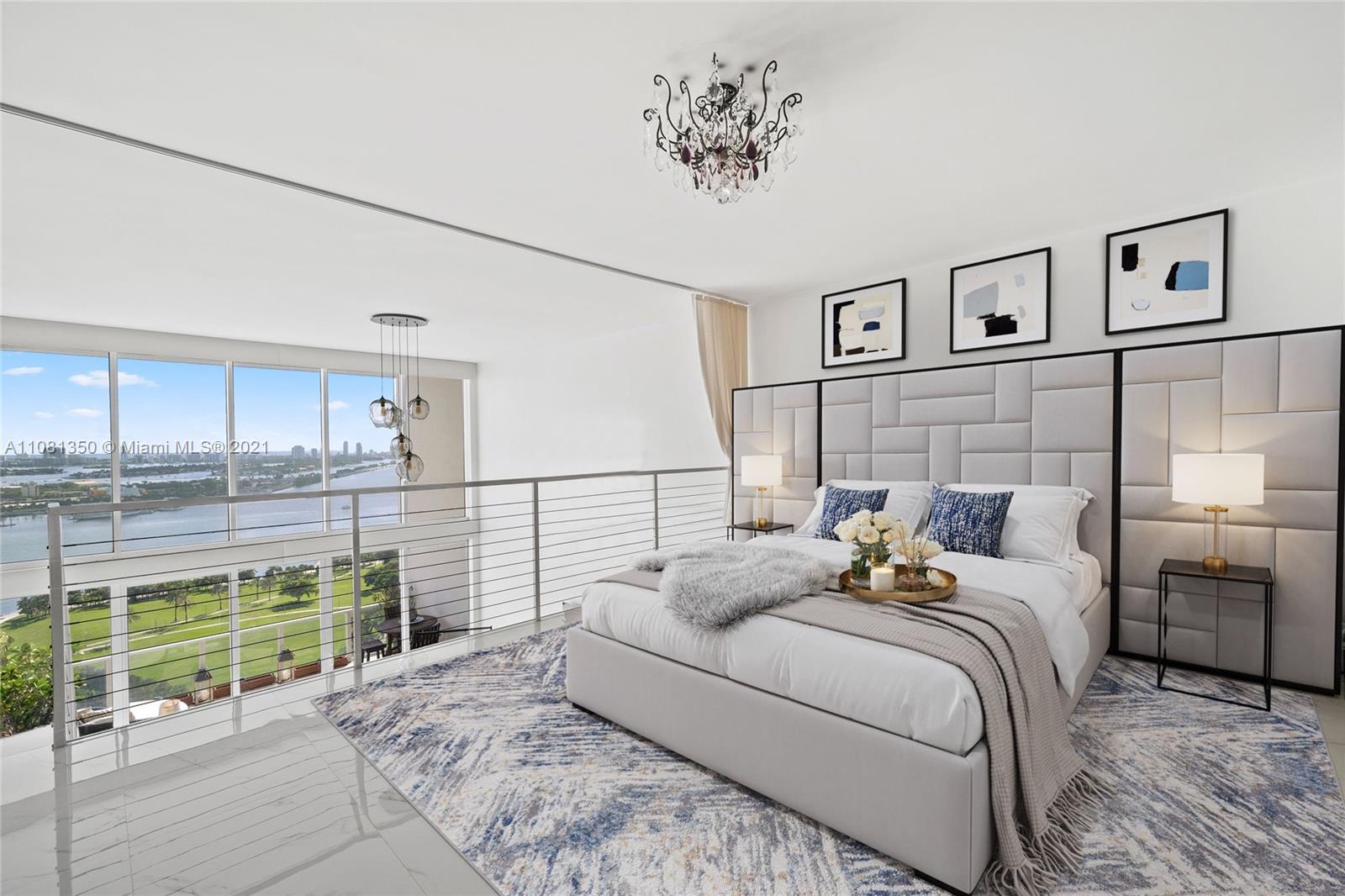 1040 Biscayne Boulevard, Unit 2403 Miami, FL 33132 - Photo 8 of 25 a bedroom with a bed and a view of kitchen