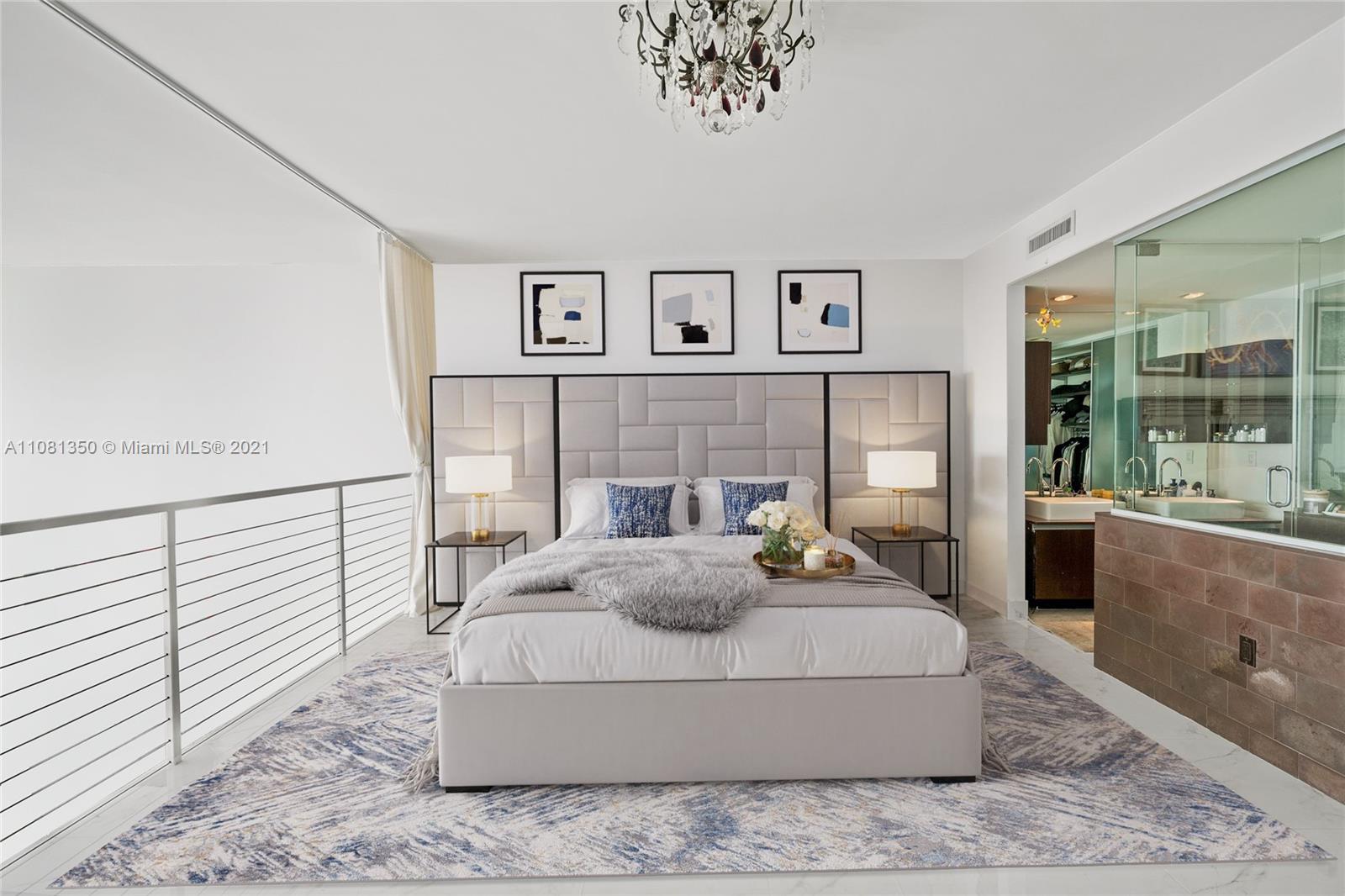 1040 Biscayne Boulevard, Unit 2403 Miami, FL 33132 - Photo 9 of 25 a living room with furniture and a large window