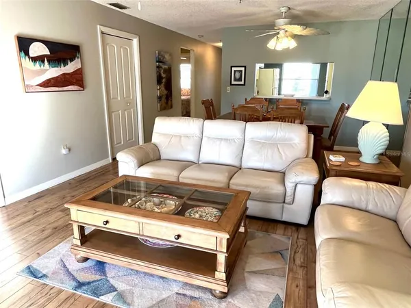 a living room with furniture and a table