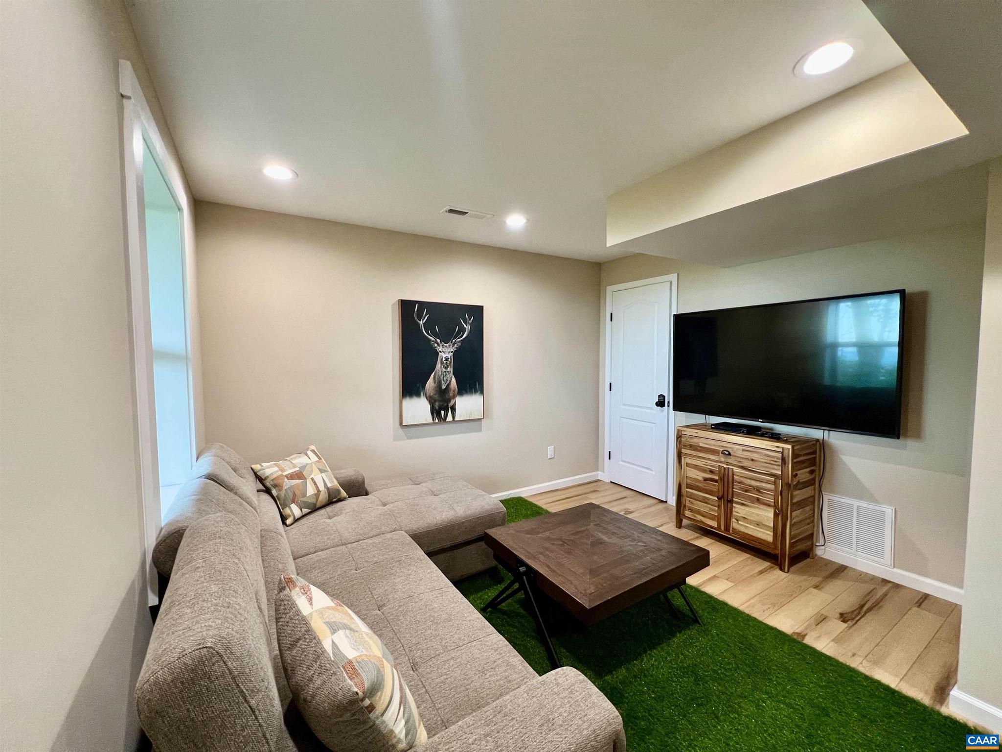 248 Raven Way Free Union, VA 22940 - Photo 27 of 47 a living room with furniture and a flat screen tv