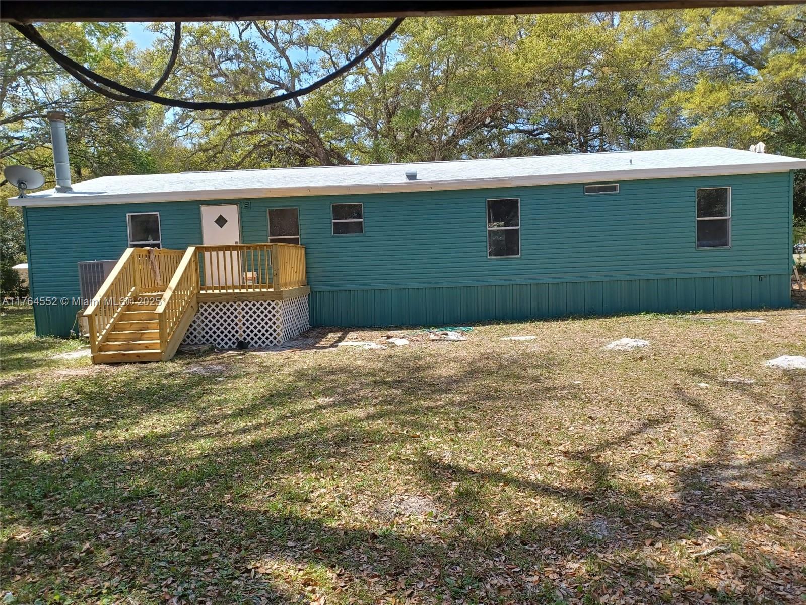 18520 Wildlife Trail Spring Hill, FL 34610 - Photo 2 of 12 a backyard of a house