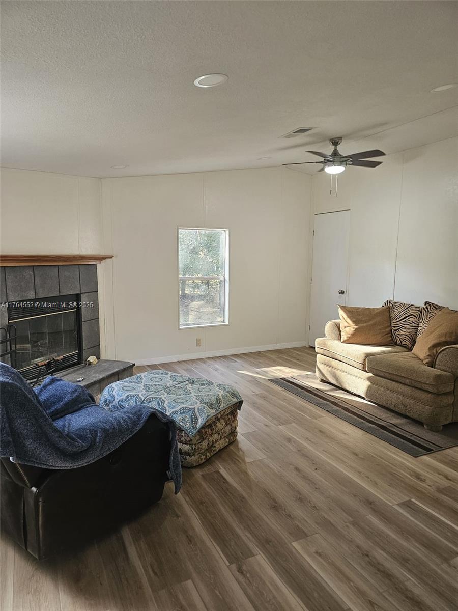 18520 Wildlife Trail Spring Hill, FL 34610 - Photo 9 of 12 a bedroom with a bed and wooden floor