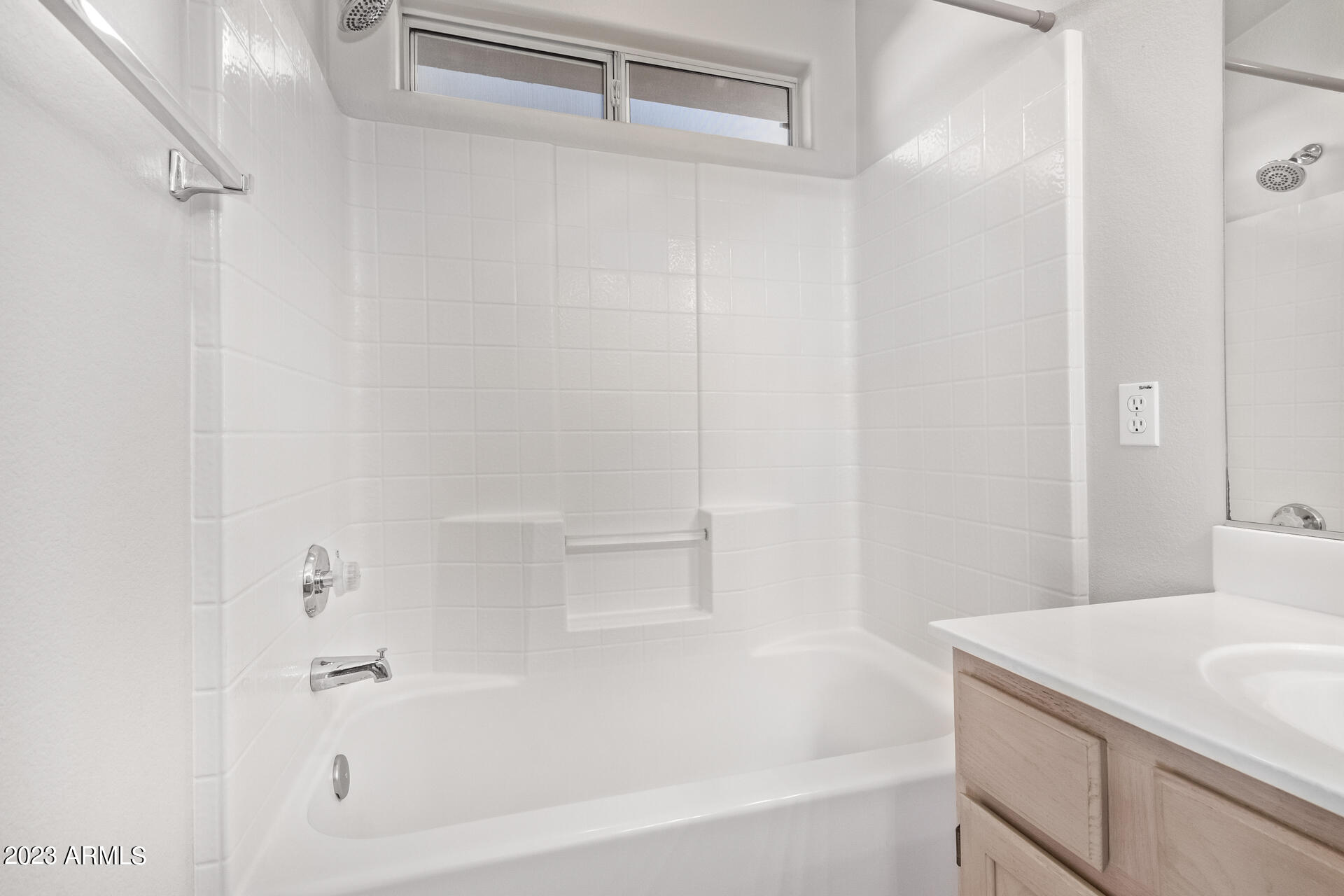 1310 East Angela Drive Phoenix, AZ 85022 - Photo 12 of 19 a white bath tub sitting next to a white sink