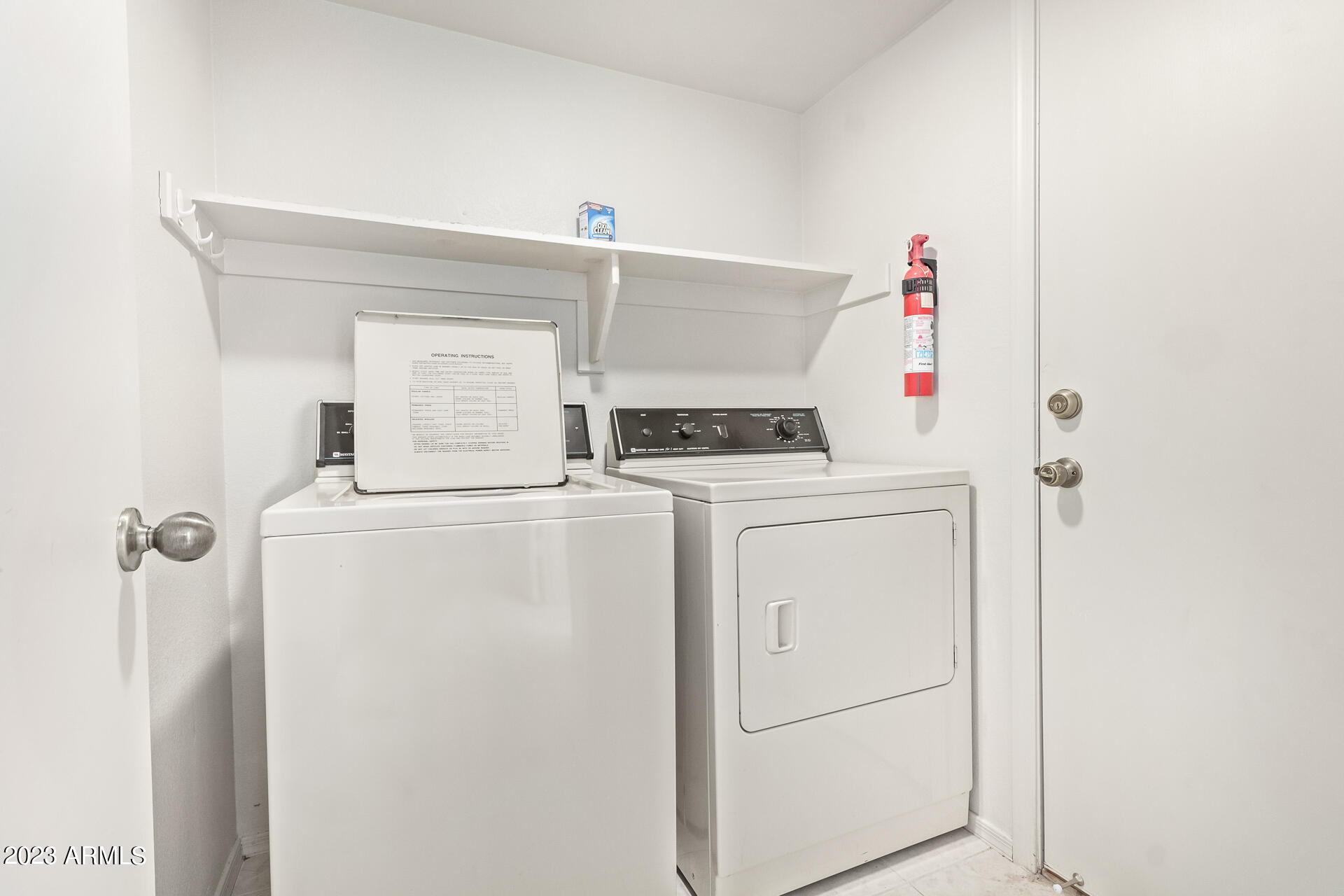 1310 East Angela Drive Phoenix, AZ 85022 - Photo 16 of 19 a utility room with dryer and washer