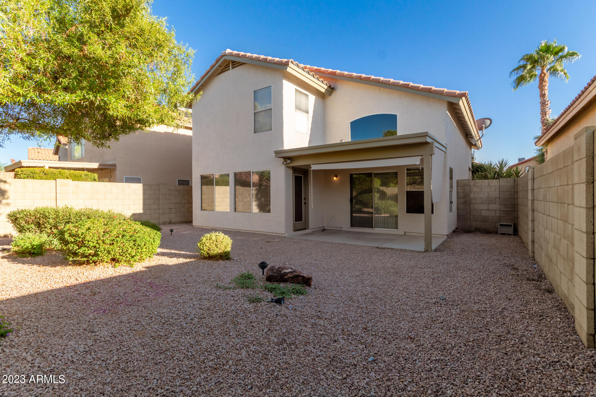 1310 East Angela Drive Phoenix, AZ 85022 - Photo 18 of 19 a front view of a house with garden