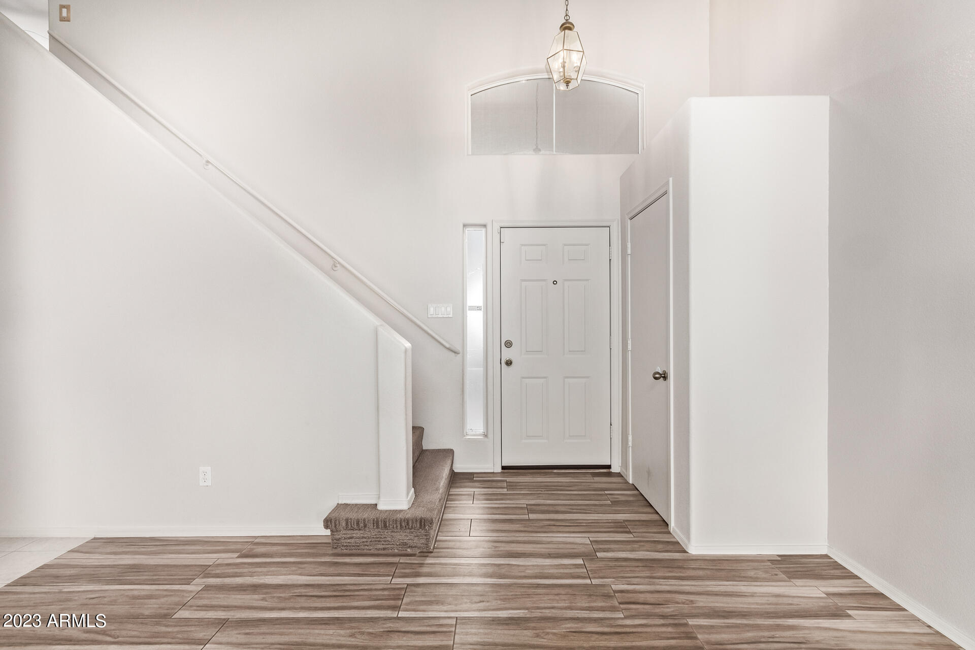 1310 East Angela Drive Phoenix, AZ 85022 - Photo 3 of 19 a view of entryway and hall with wooden floor