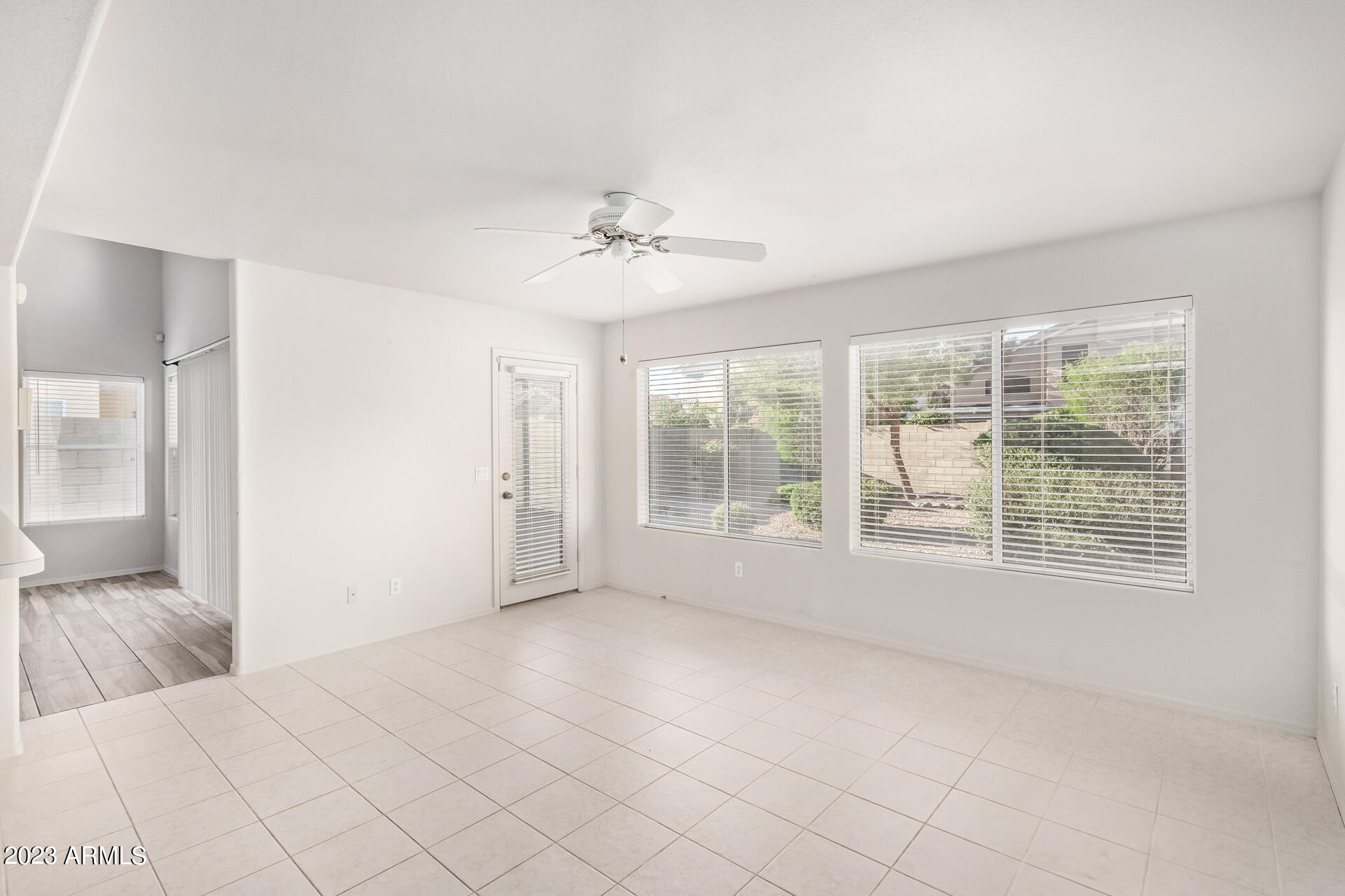 1310 East Angela Drive Phoenix, AZ 85022 - Photo 5 of 19 a view of an empty room with a window