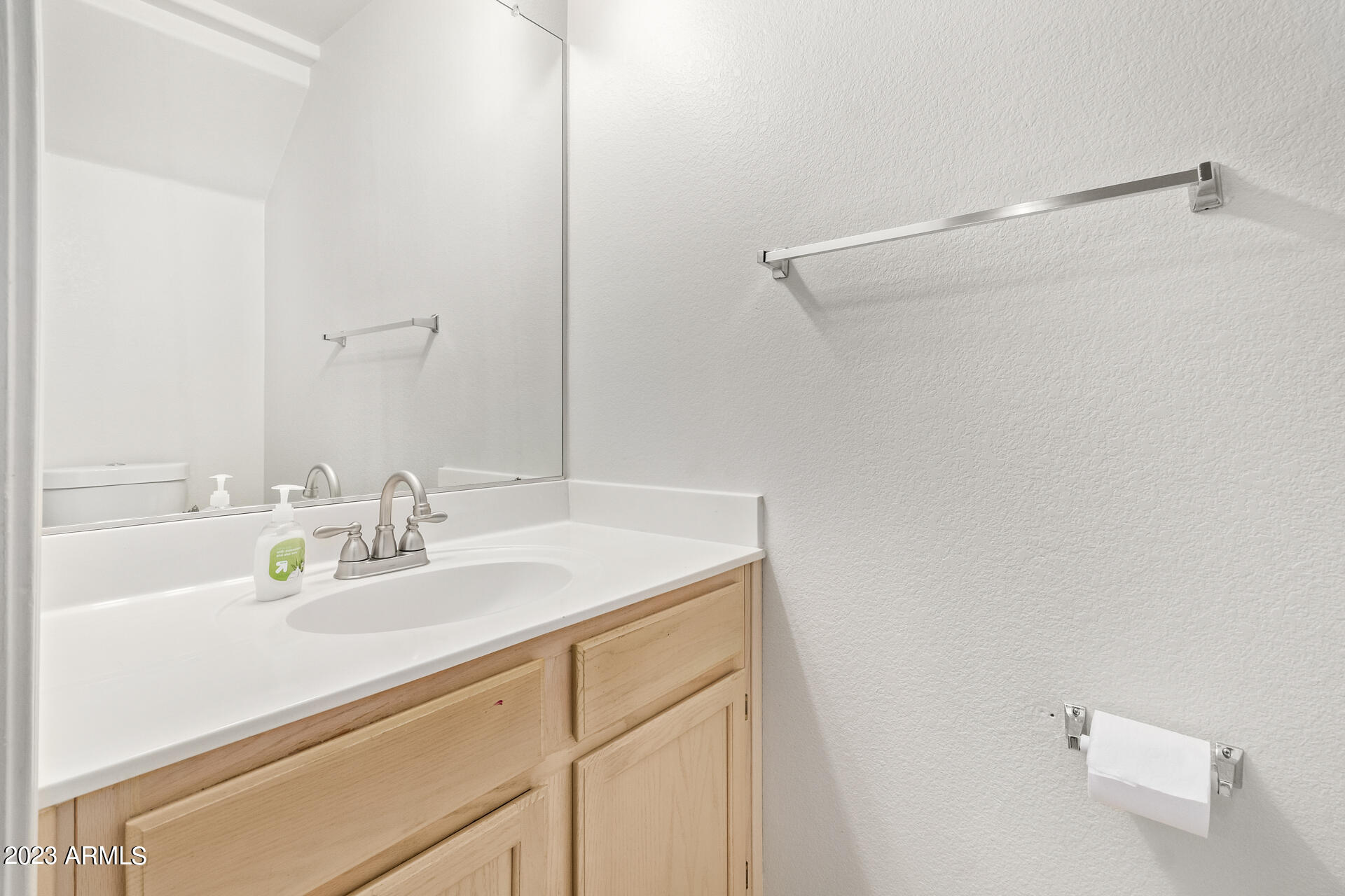 1310 East Angela Drive Phoenix, AZ 85022 - Photo 7 of 19 a bathroom with a sink and a mirror
