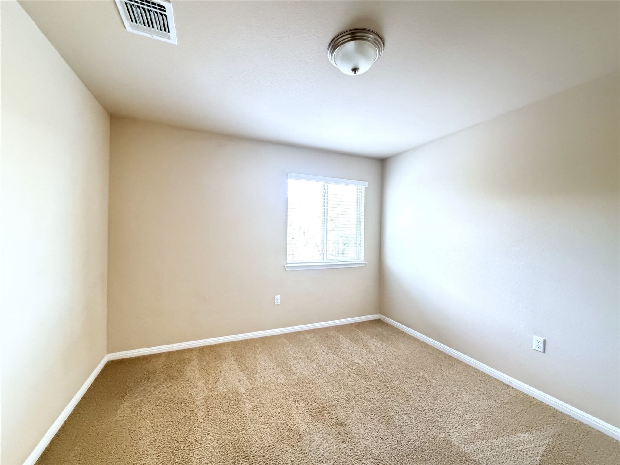 1437 Brooks Way Leander, TX 78641 - Photo 11 of 16 an empty room with a window
