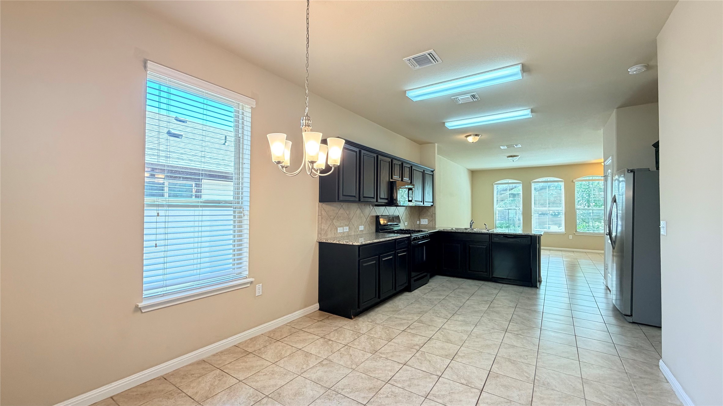 1437 Brooks Way Leander, TX 78641 - Photo 4 of 16 a large bathroom with a large tub shower and sink