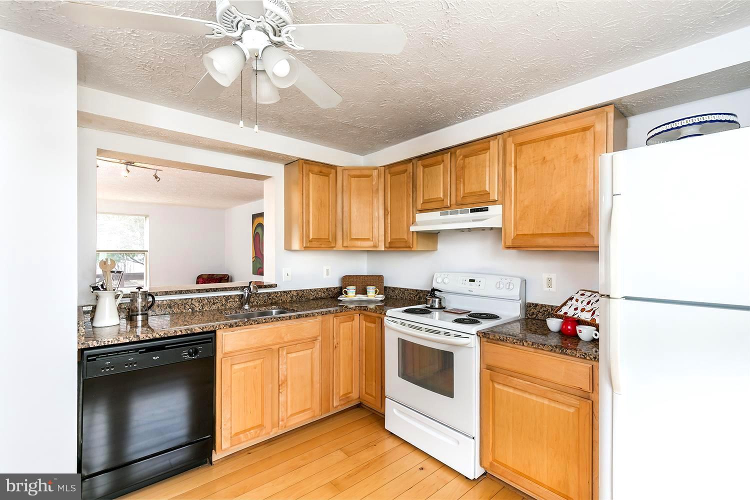 Kitchen with Granite Counters and Wood Cabinets