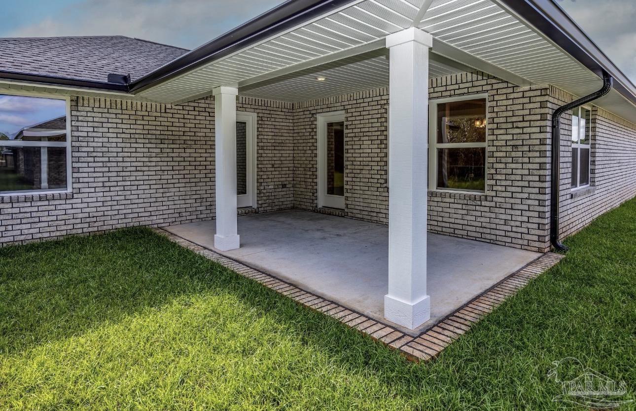 7657 Small Pnes Street Milton, FL 32583 - Photo 24 of 26 a view of a patio in backyard