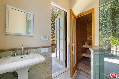 a bathroom with a sink and a mirror