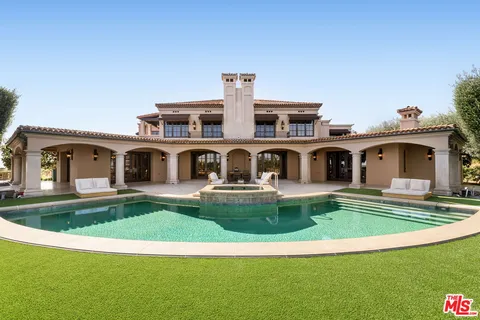 a front view of house with yard having outdoor seating